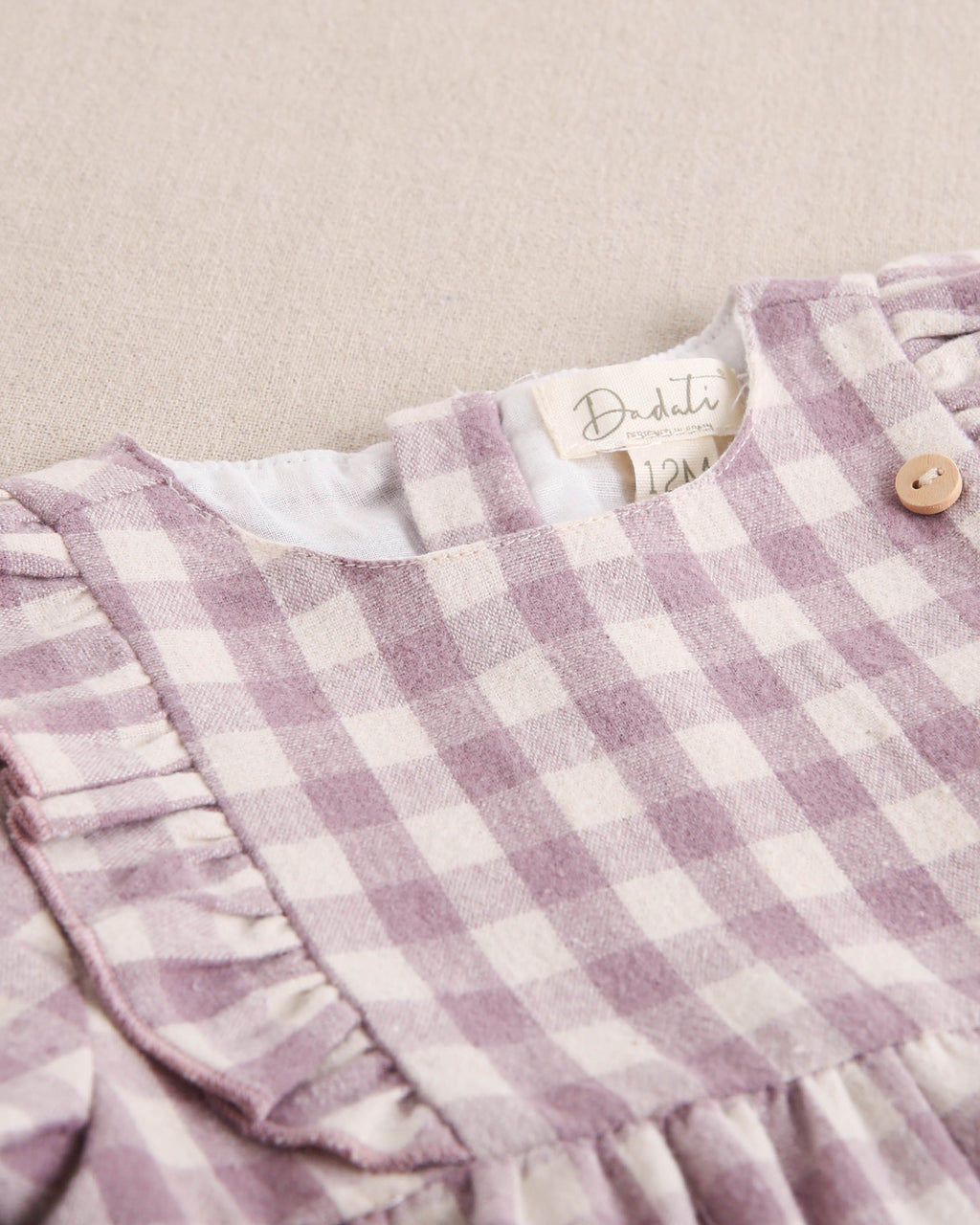 Vestido de bebé niña de cuadros malva y beige
