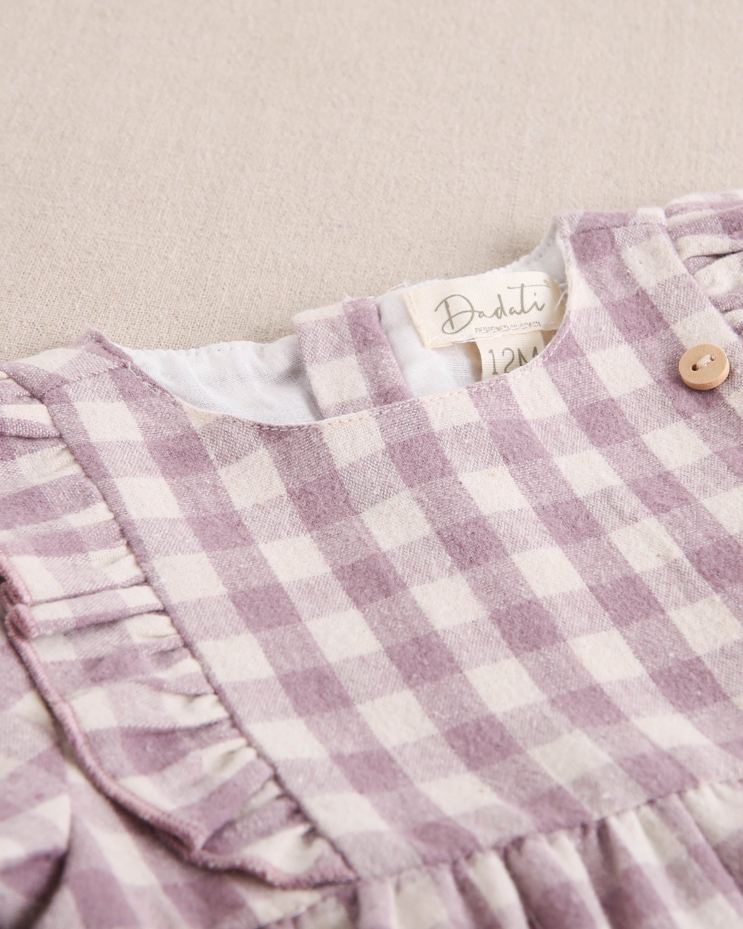 Vestido de bebé niña de cuadros malva y beige