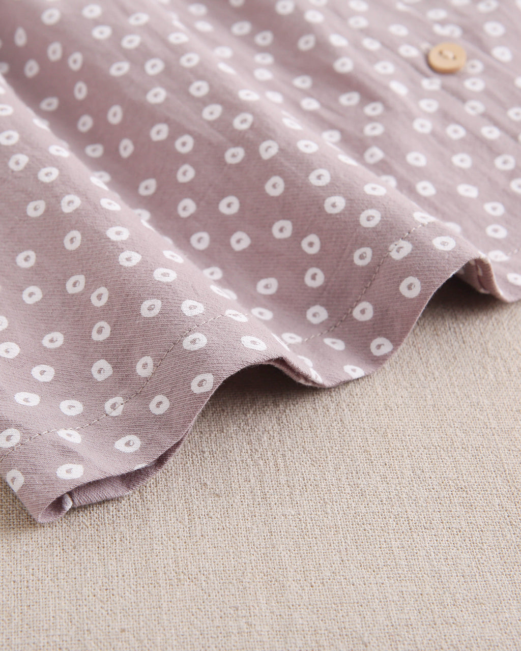Vestido de bebé niña malva con estampado geométrico