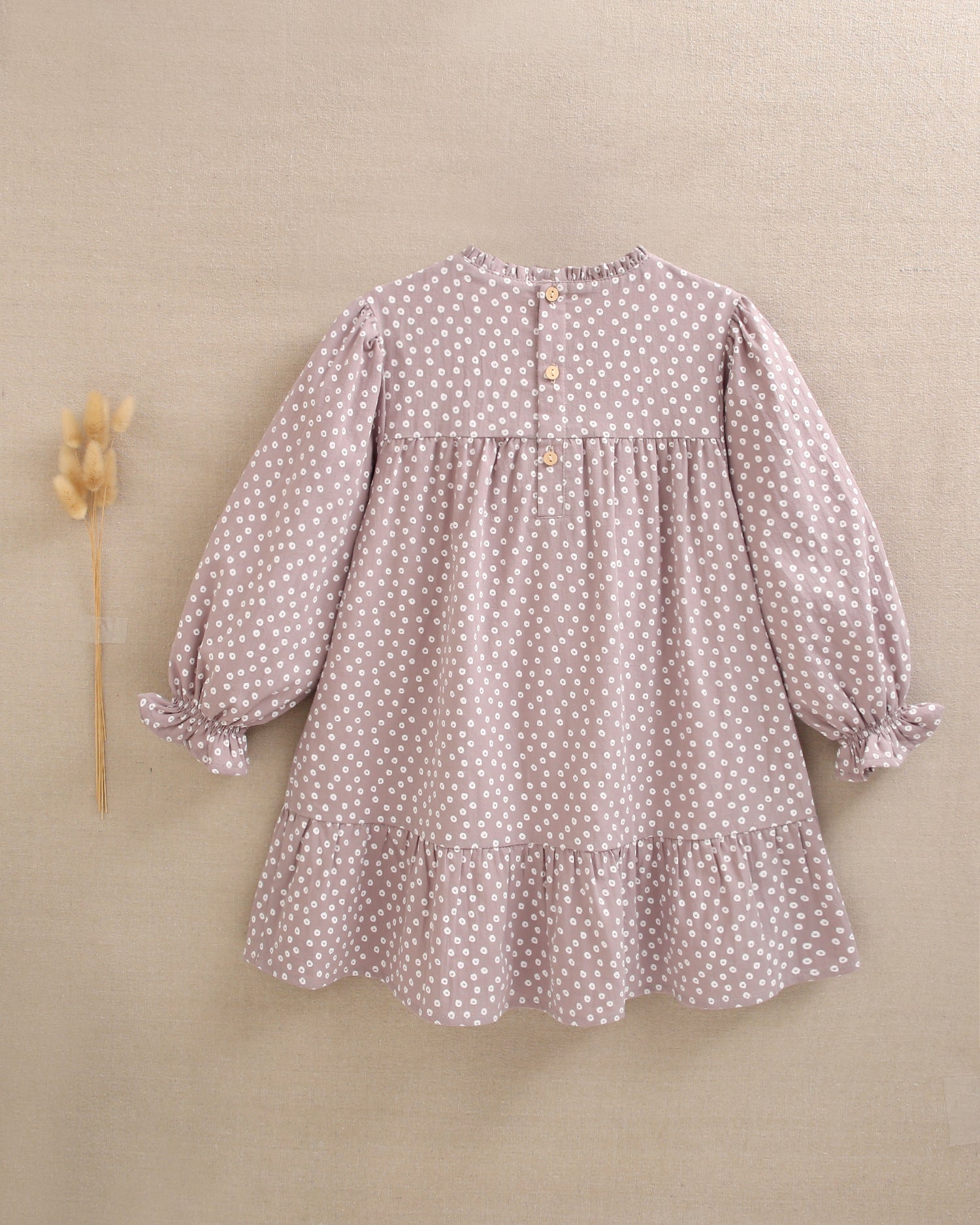 Vestido de niña malva con estampado geométrico