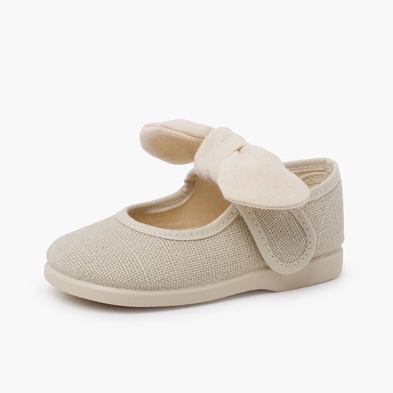 Mercedita niña de lino con lazo y cierre adherente color crudo