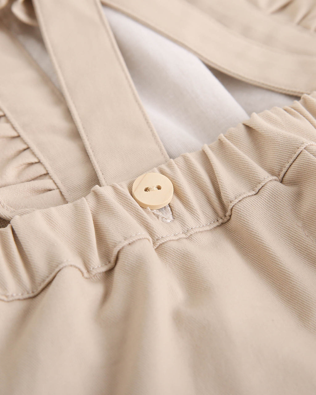 Jardinera de niña largo en beige con volantes