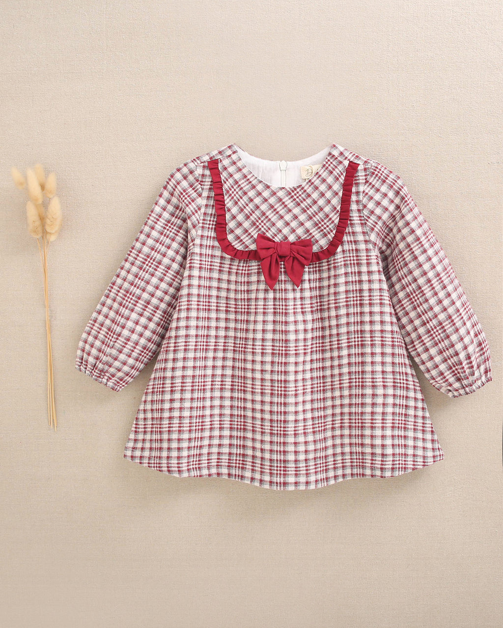 Vestido de bebé niña cuadros granate y detalle de lazo