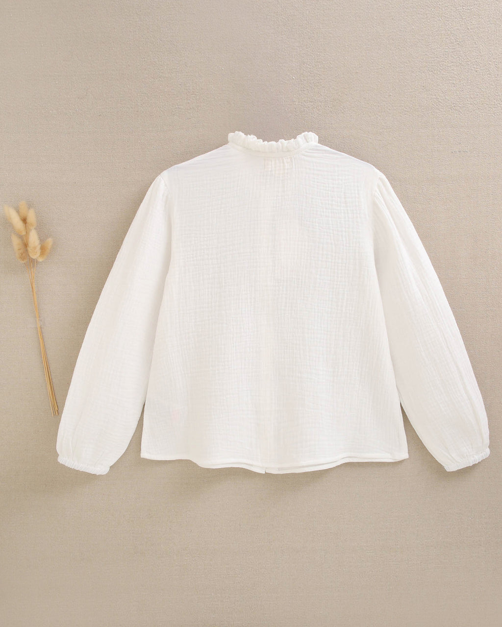 Blusa de niña de muselina blanca con cuello Peter Pan