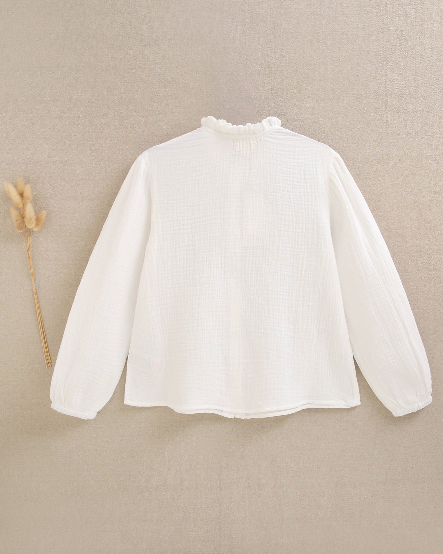 Blusa de niña de muselina blanca con cuello Peter Pan