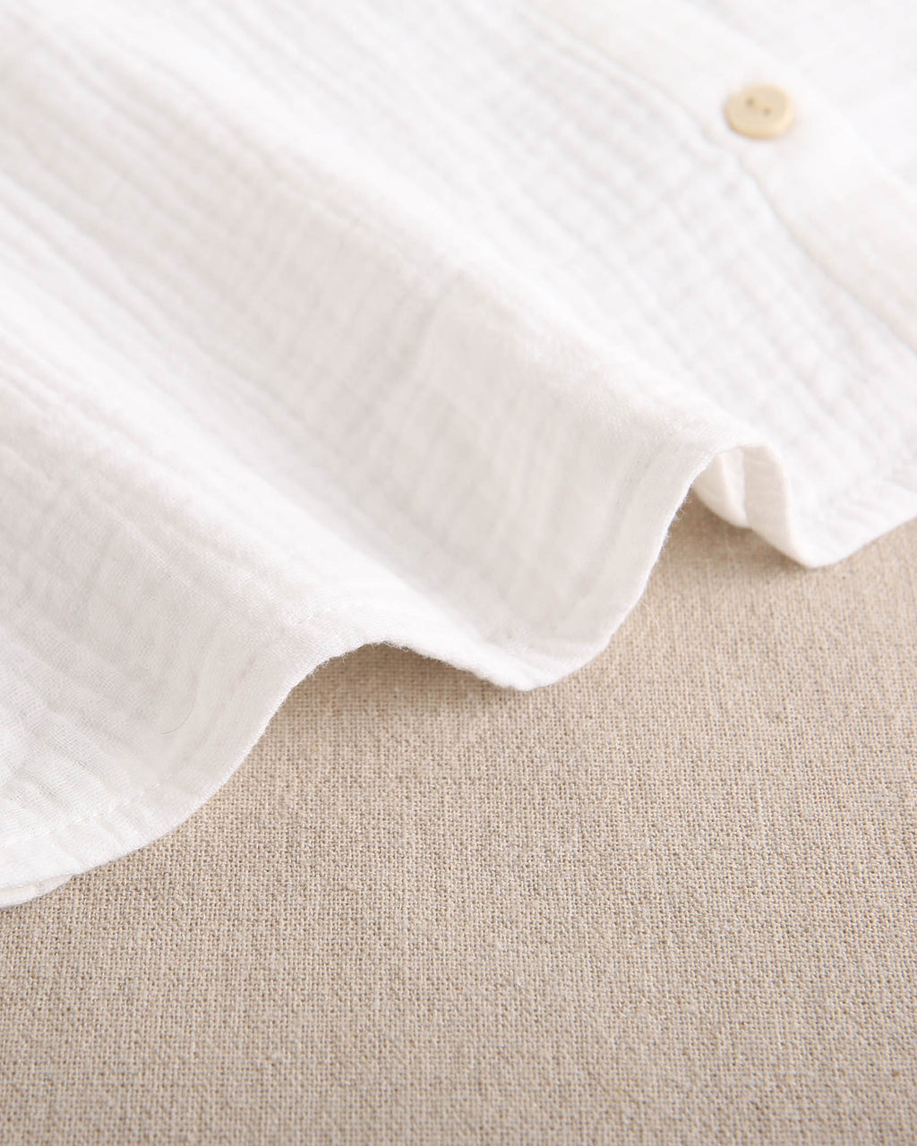 Blusa de niña de muselina blanca con cuello Peter Pan