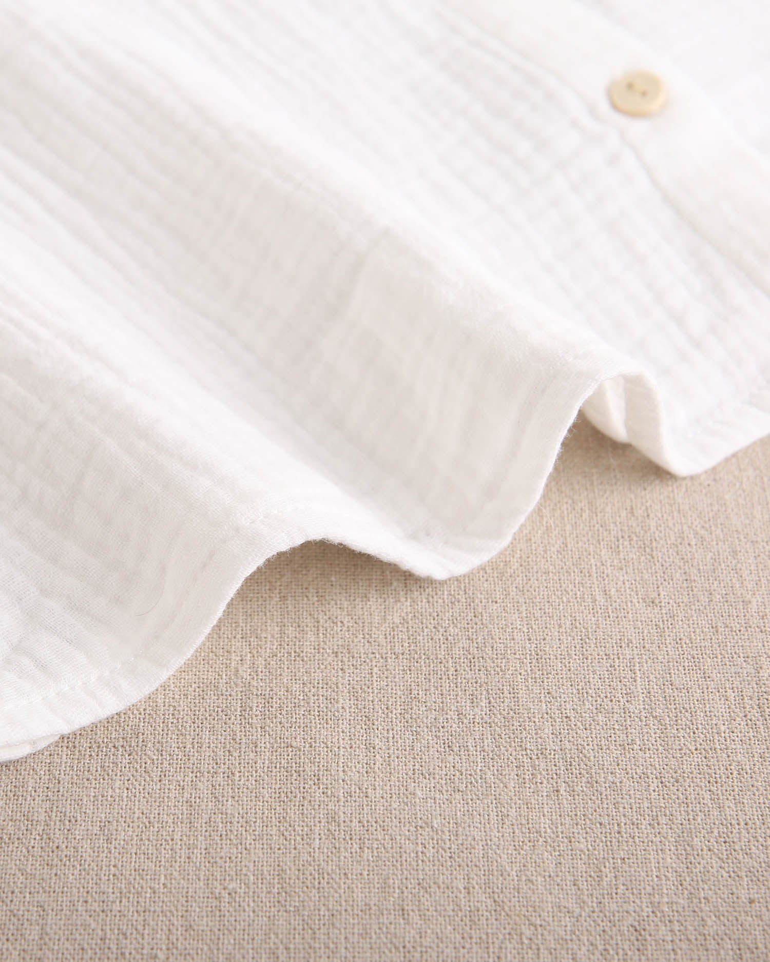 Blusa de niña de muselina blanca con cuello Peter Pan