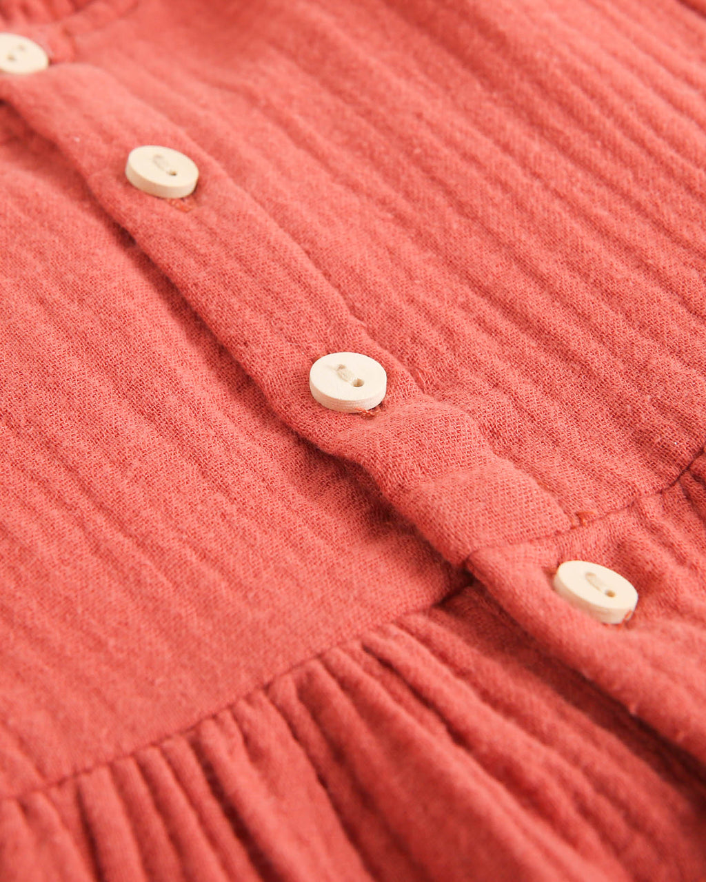 Vestido de bebé niña de muselina teja con cuello de cuadros