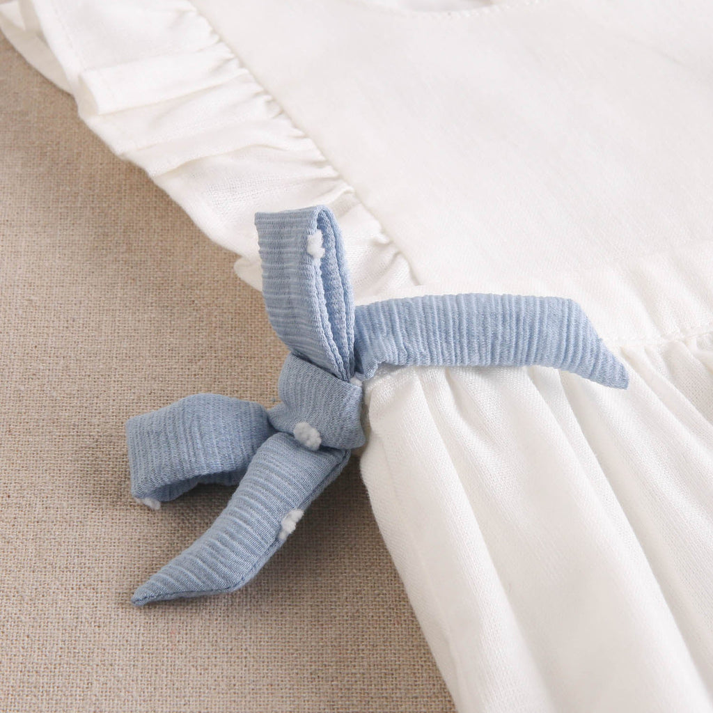 Ranita bebé niña blanca con lazos celestes