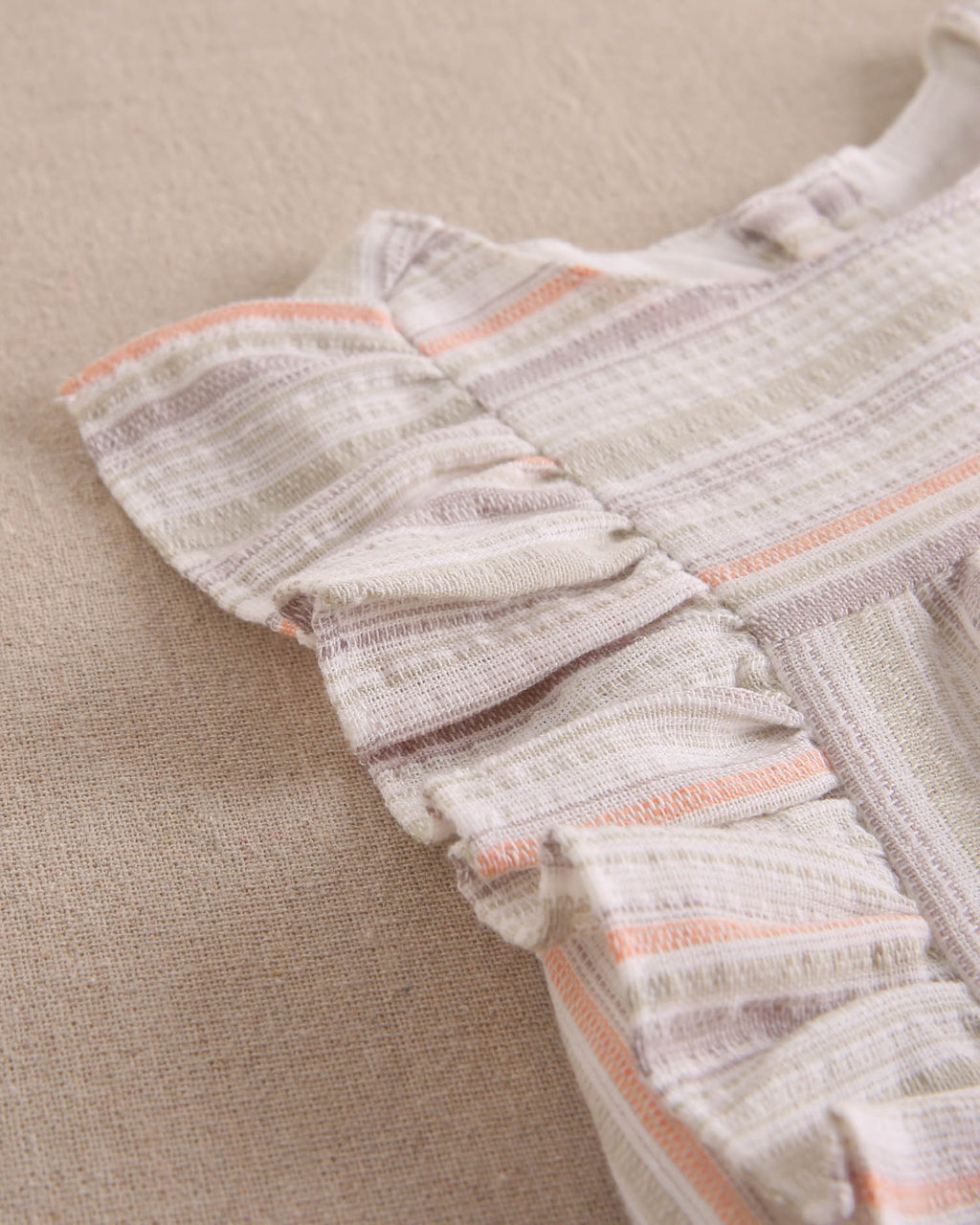 Vestido bebé niña rayas naranja, gris y verde, con borla naranja flúor