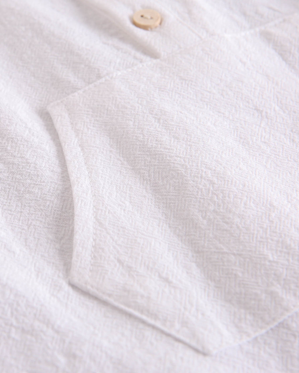 Conjunto bebé niño camisa con bolsillo canguro y short naranja de rayas