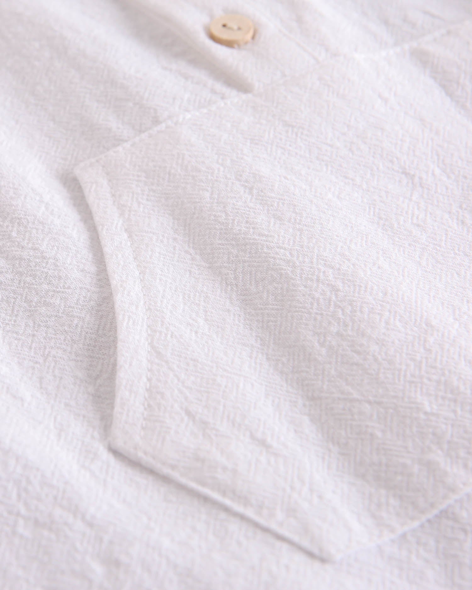 Conjunto bebé niño camisa con bolsillo canguro y short naranja de rayas