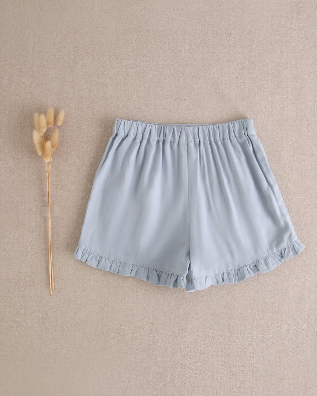 Short niña azul con volantes en bajo