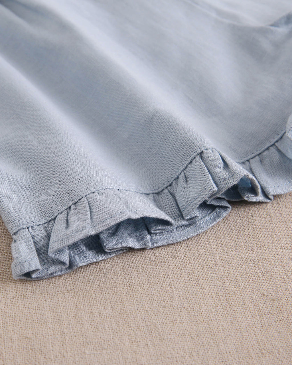 Short niña azul con volantes en bajo