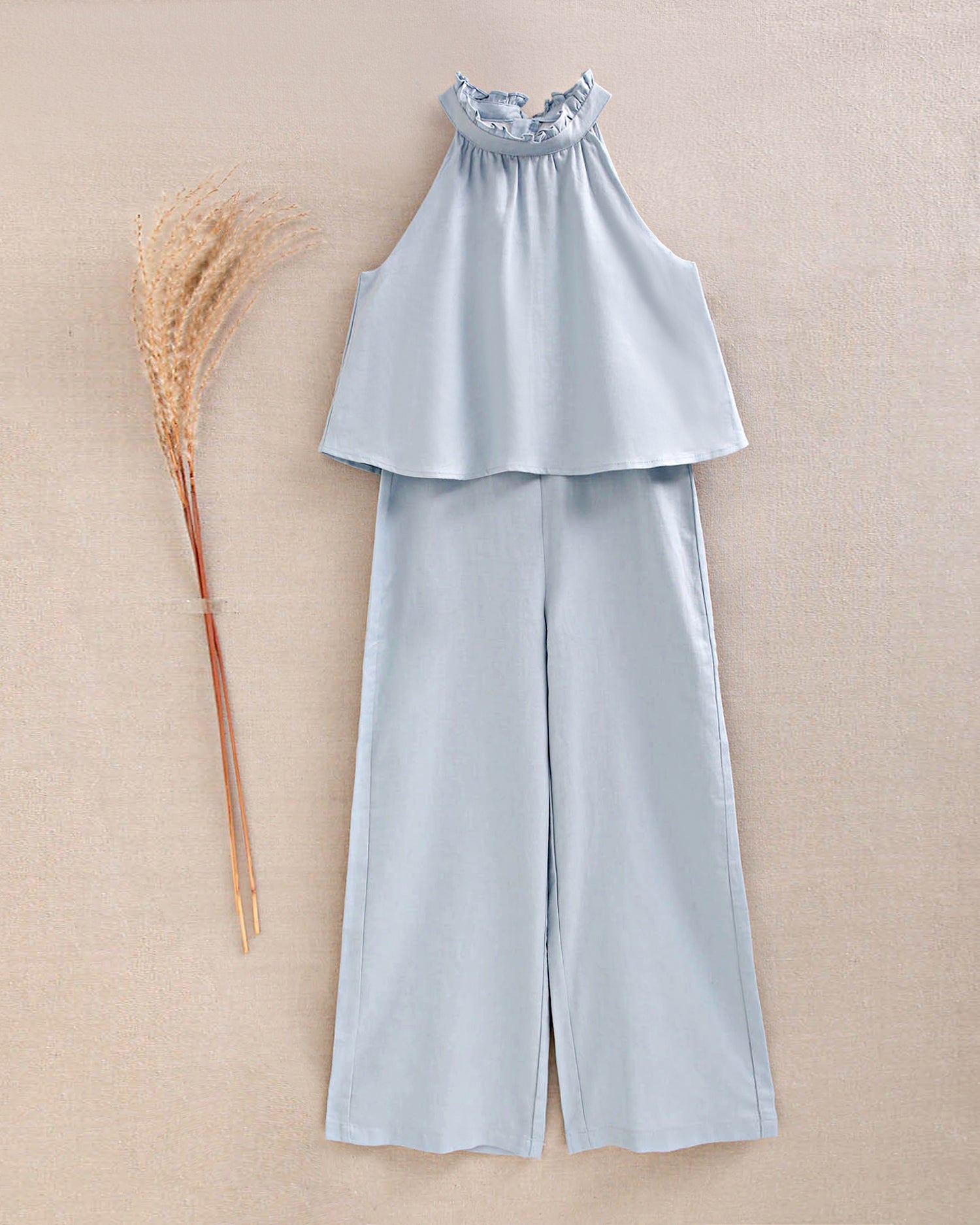 Enterito niña azul con cuello halter y nudo