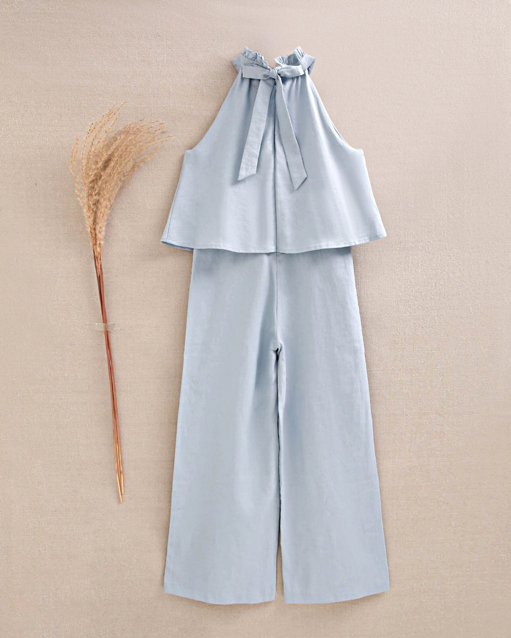 Enterito niña azul con cuello halter y nudo