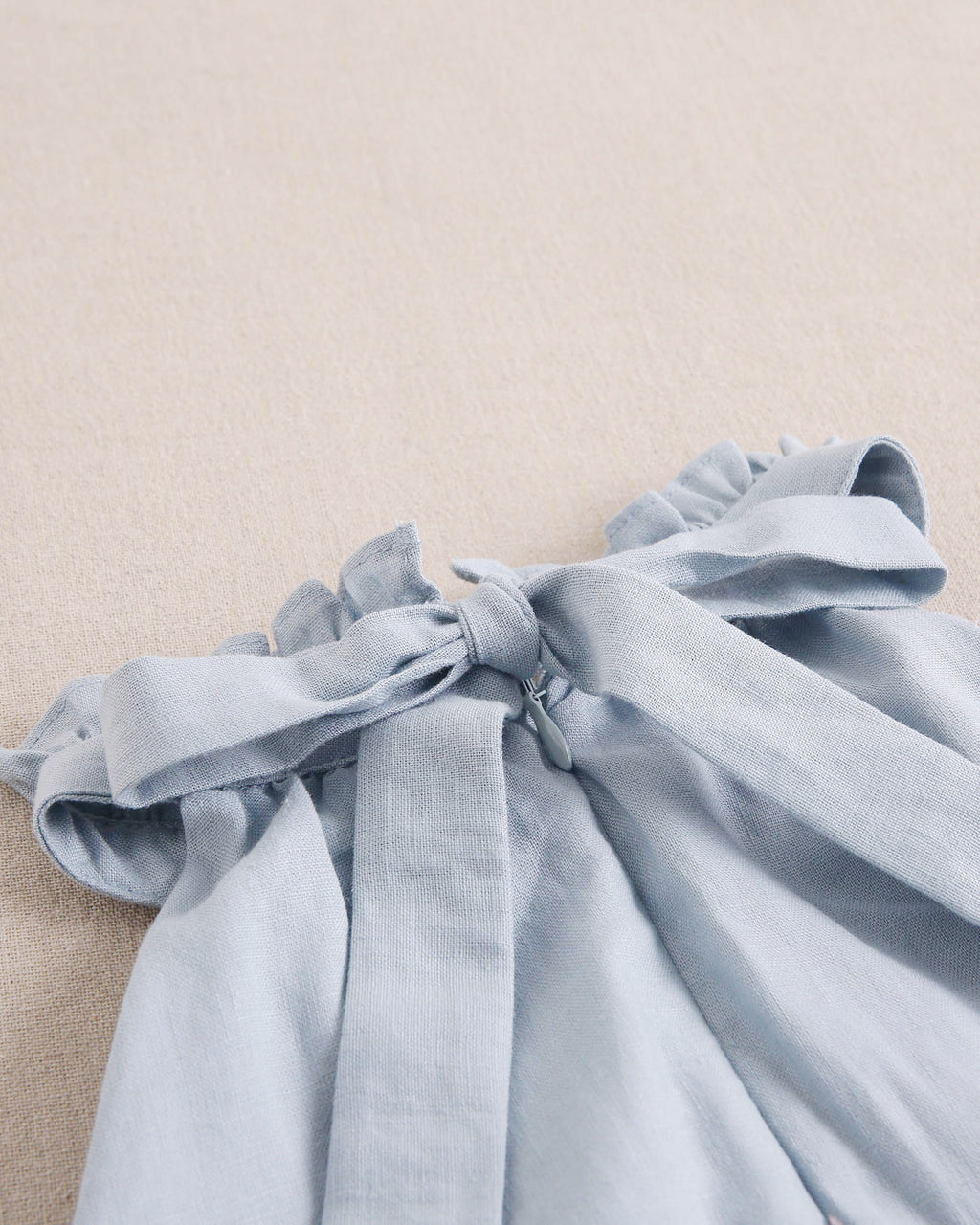 Enterito niña azul con cuello halter y nudo