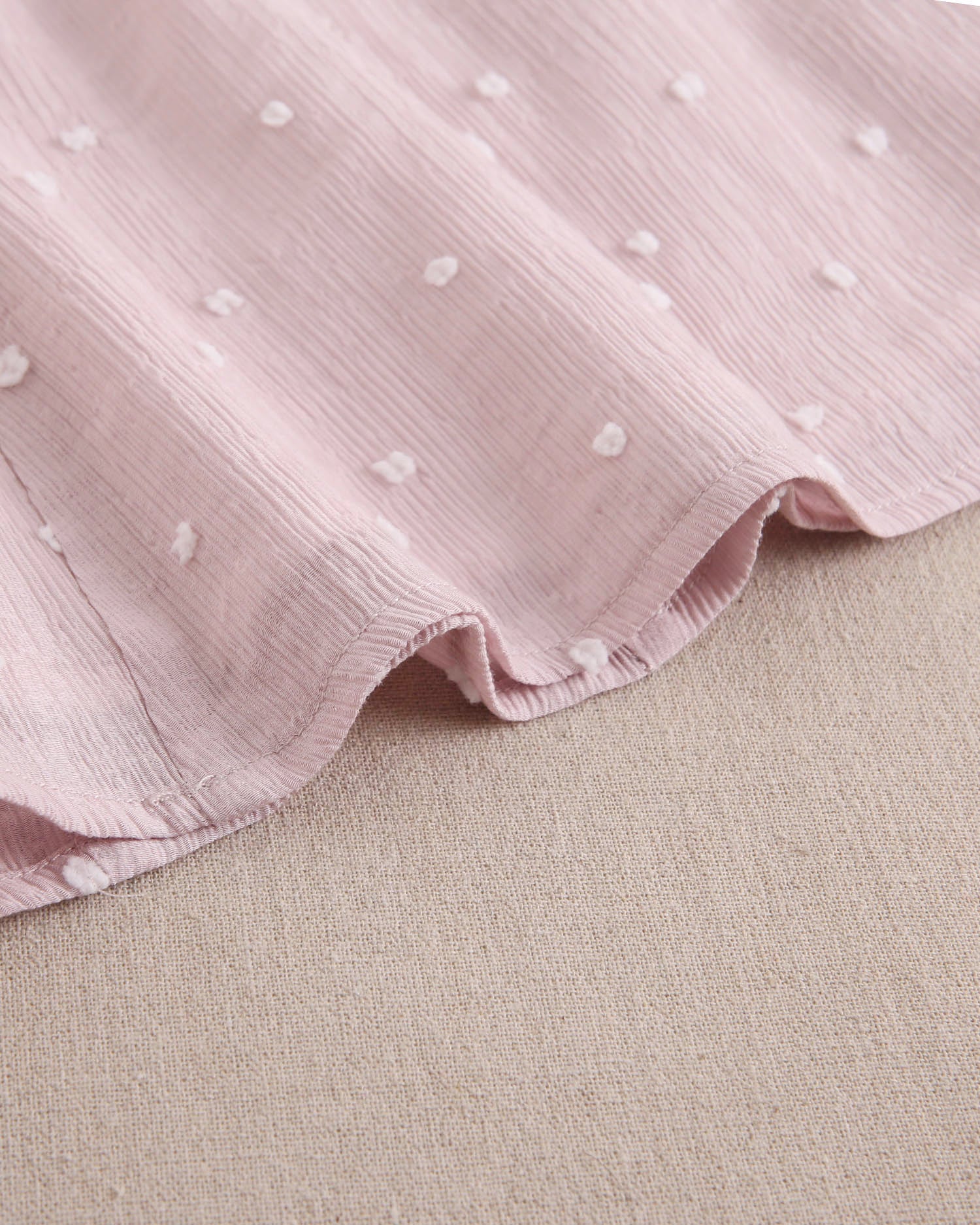 Vestido niña de plumeti rosa con mini topitos blancos y mangas volante