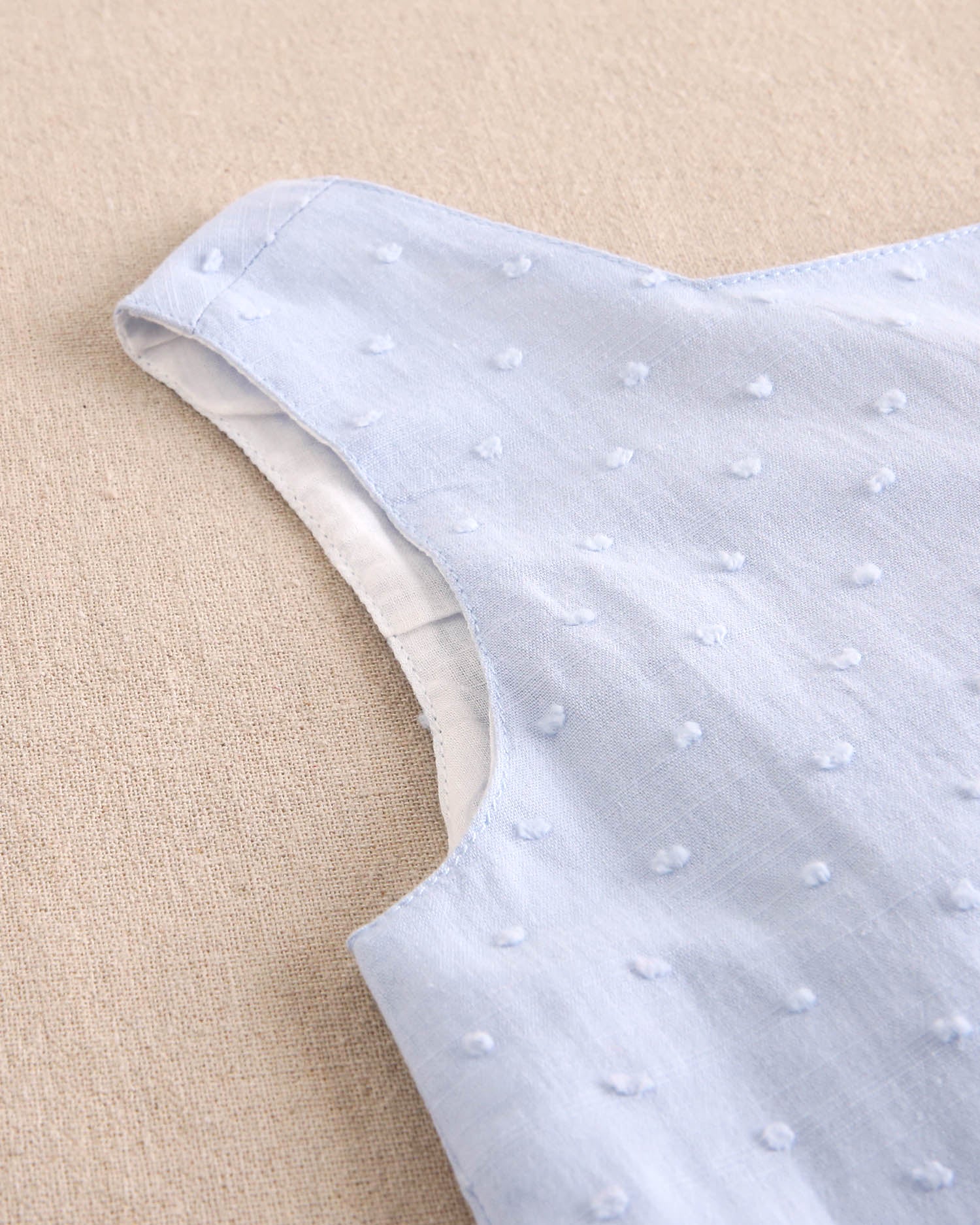 Enterito niña corto de plumeti azul con maxi lazo