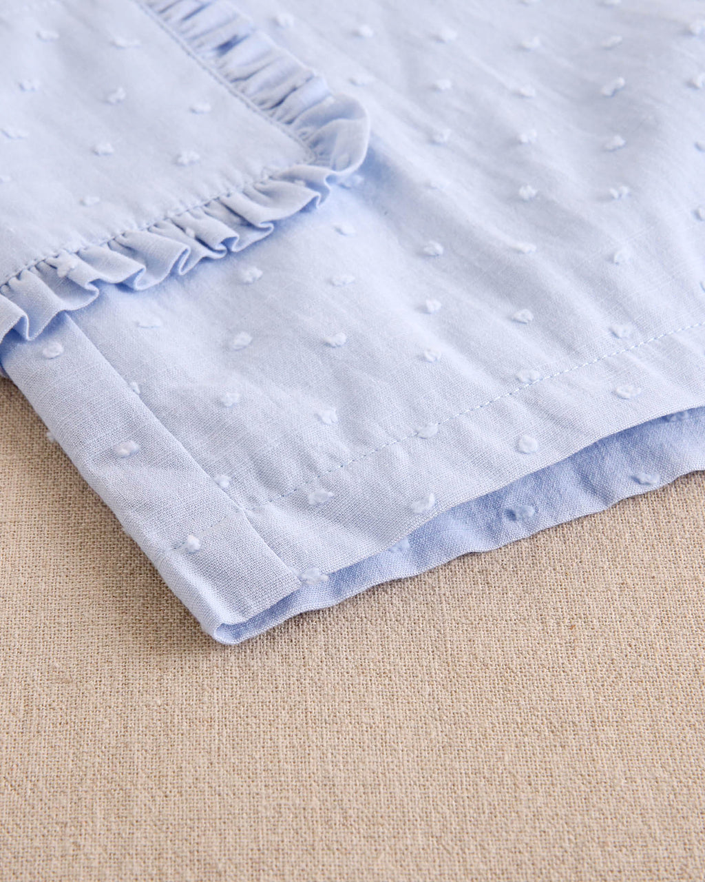 Enterito niña corto de plumeti azul con maxi lazo