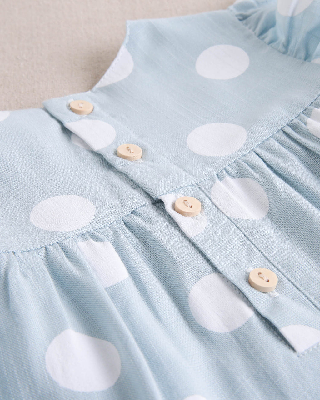Vestido de bebé niña azul cielo con lunares blancos