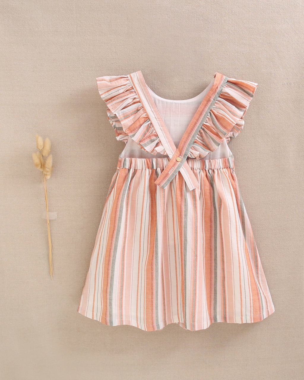 Vestido niña de mix de rayas naranjas, verdes y blancas y espalda cruzada