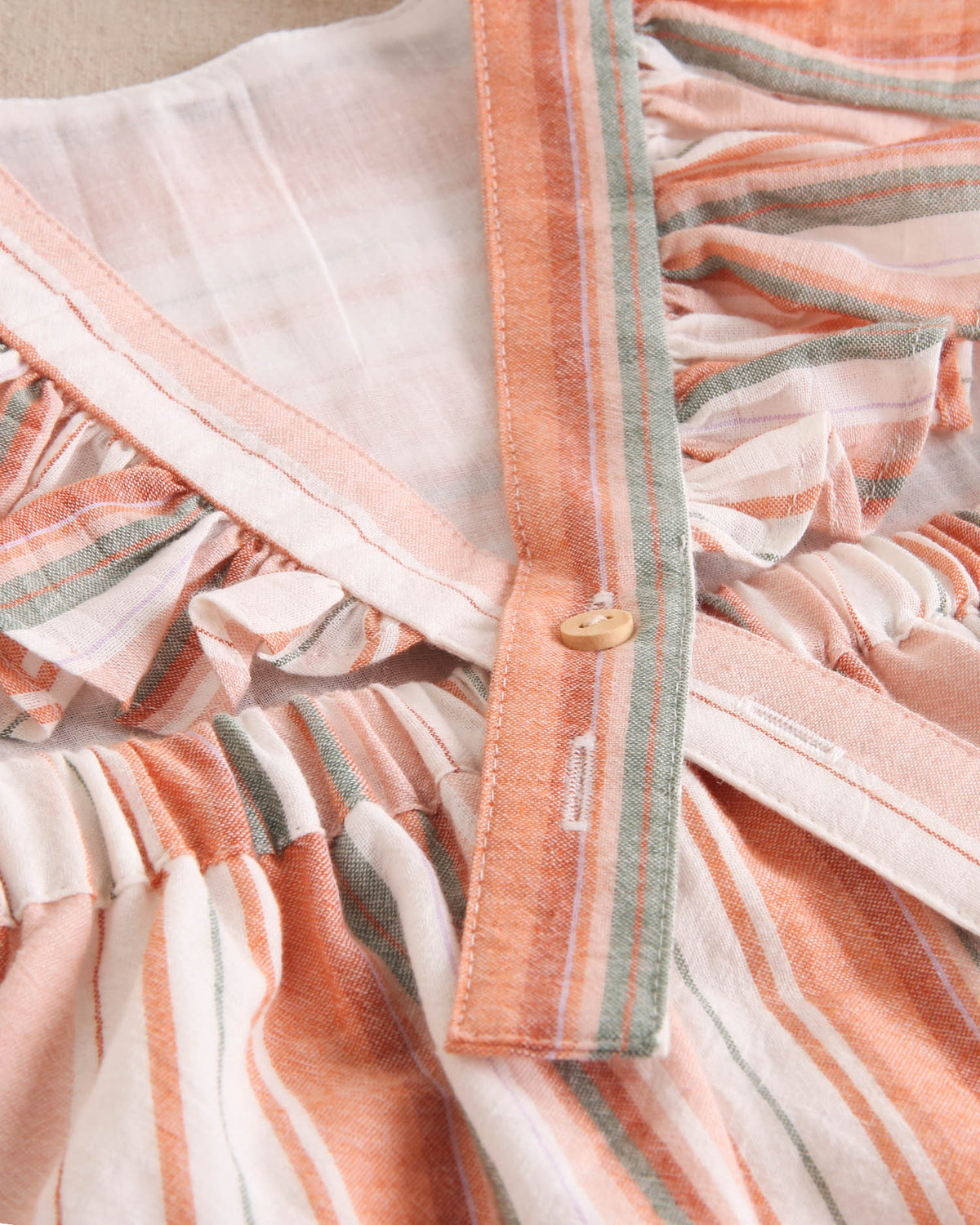 Vestido niña de mix de rayas naranjas, verdes y blancas y espalda cruzada