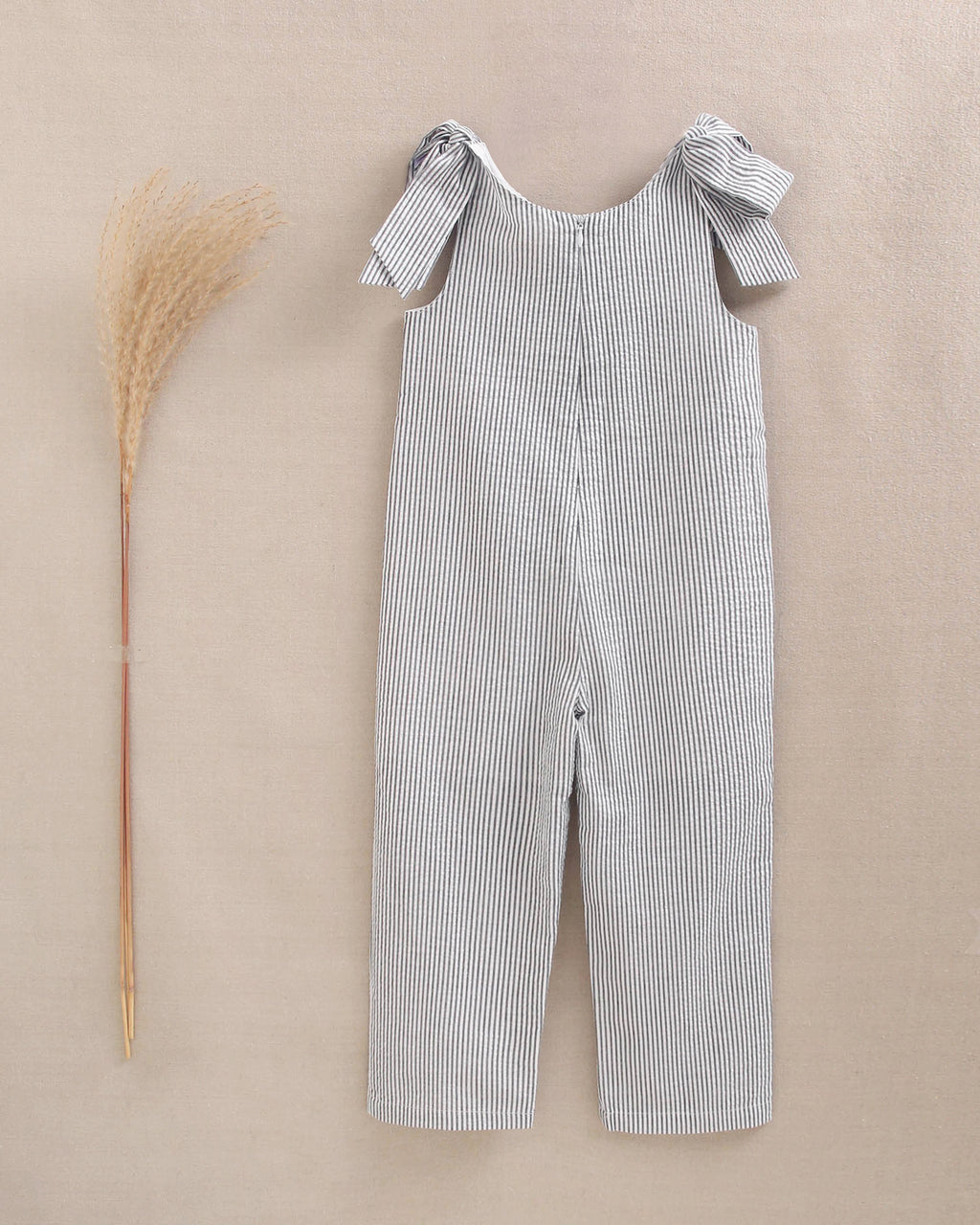 Enterito niña en rayas negras y azul marino con lazadas