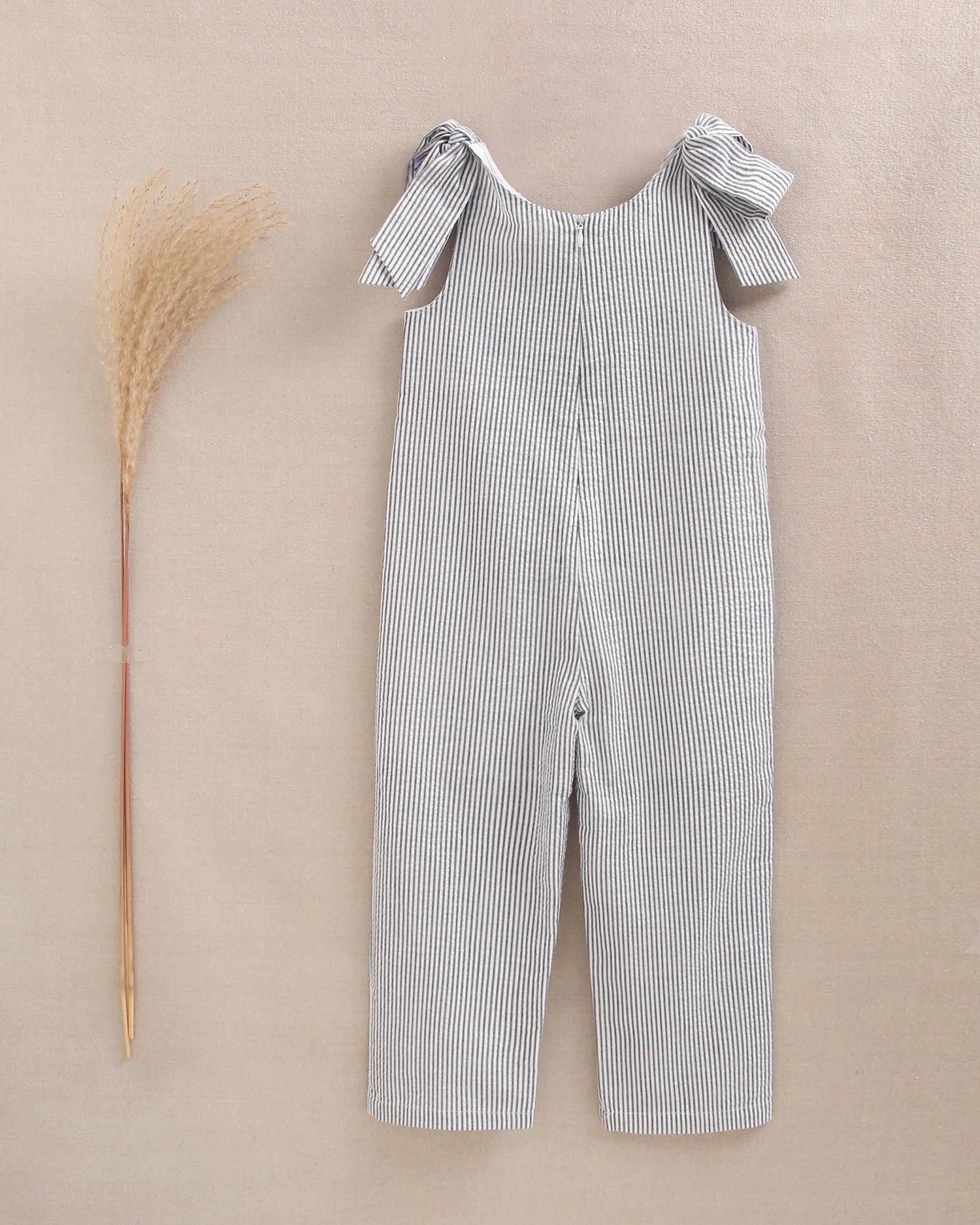 Enterito niña en rayas negras y azul marino con lazadas