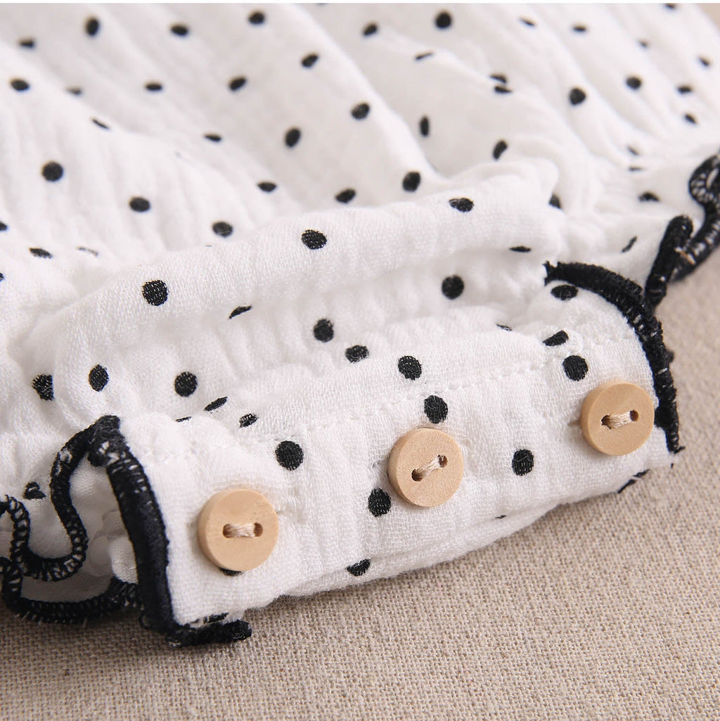 Ranita bebé niña blanca con topitos, contraste y lazos en negro