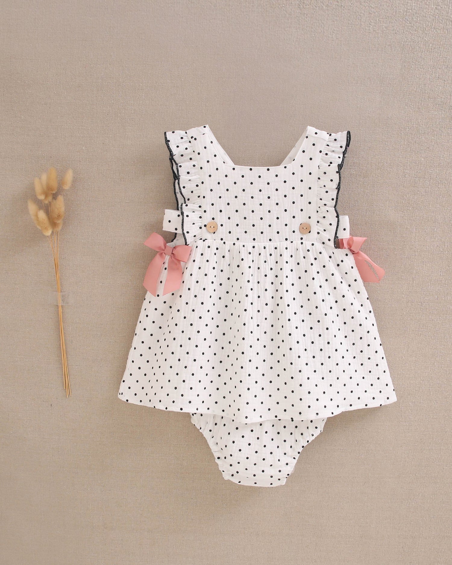 Vestido bebé niña blanco con topitos negros y lazos rosas