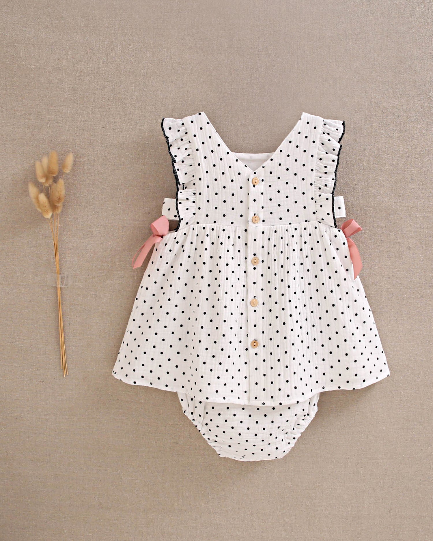 Vestido bebé niña blanco con topitos negros y lazos rosas