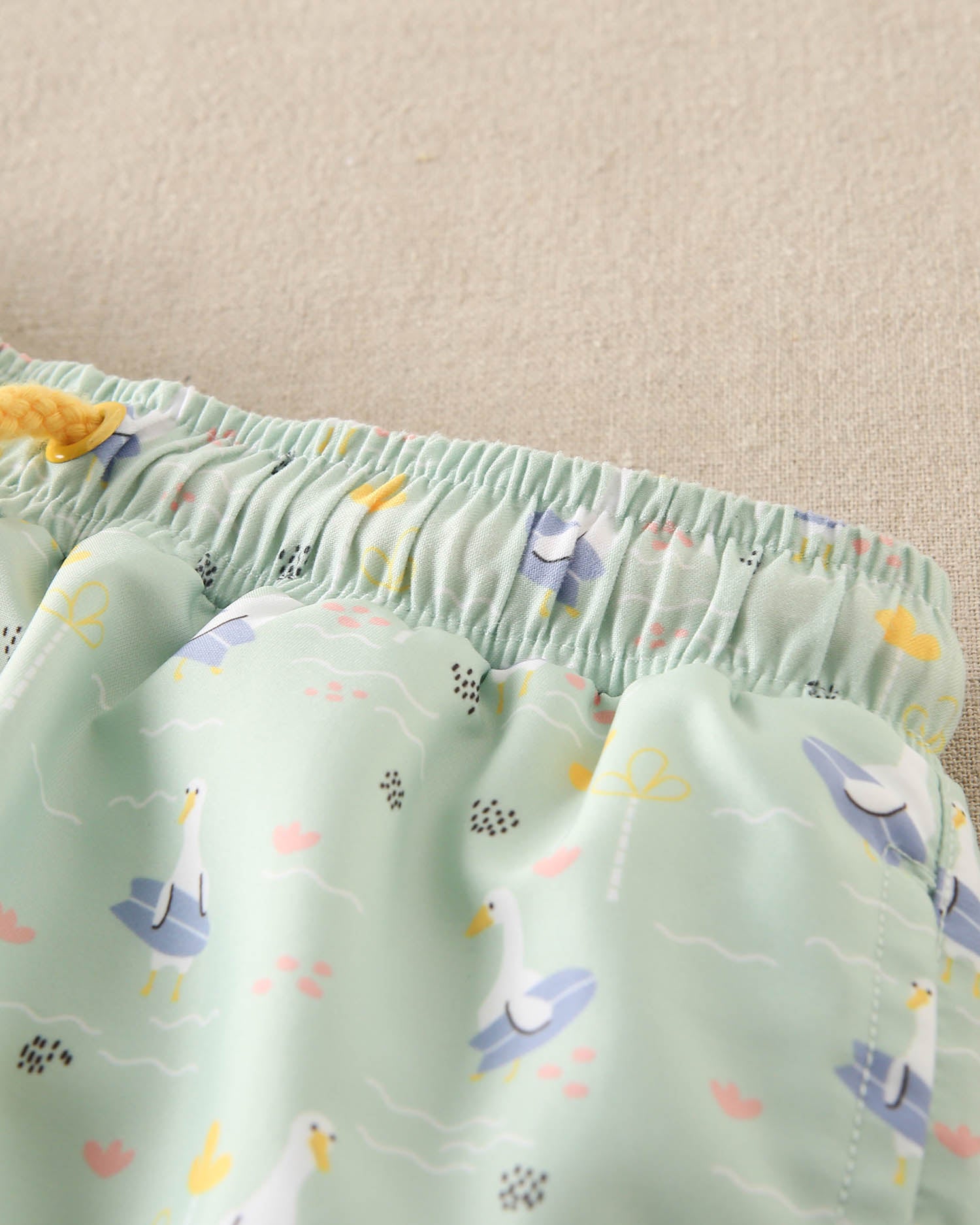 Traje de baño niño verde con lila