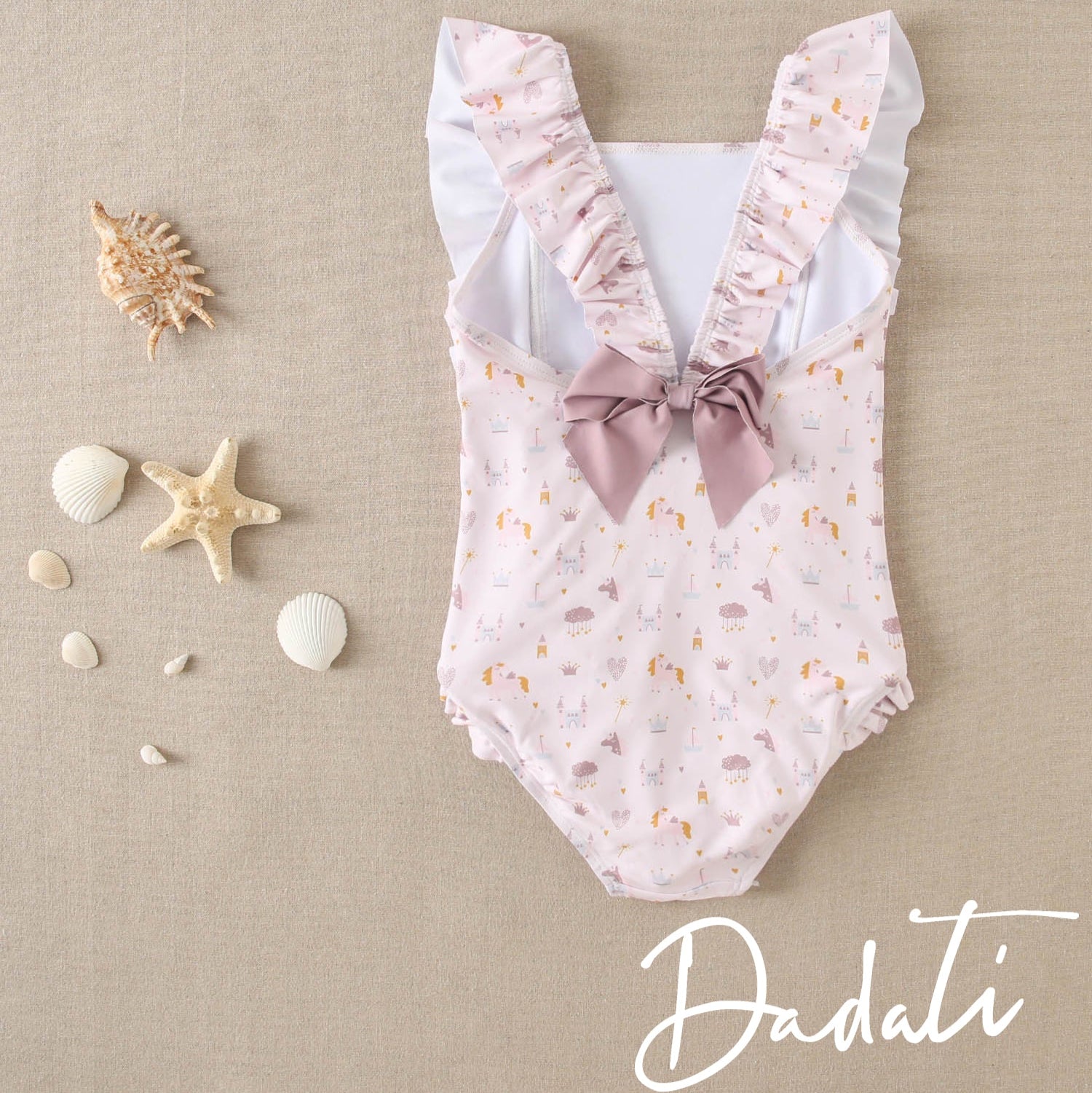 Traje de baño niña rosado con vuelos laterales