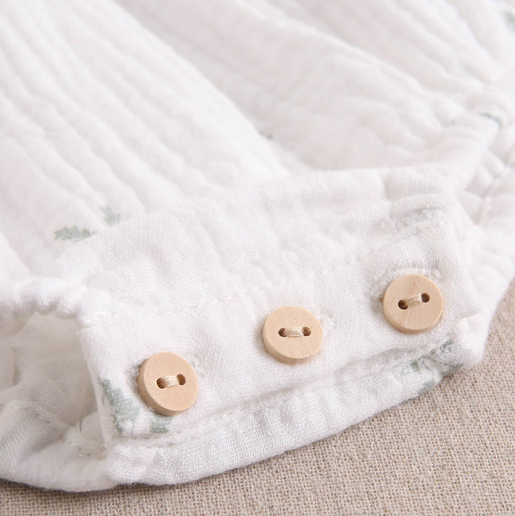 Ranita bebé niña crudo con estampado de ramas verde pastel