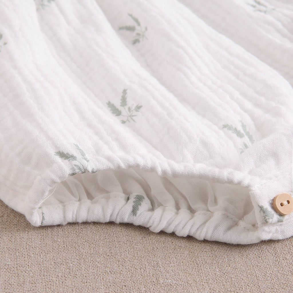 Ranita bebé niña crudo con estampado de ramas verde pastel