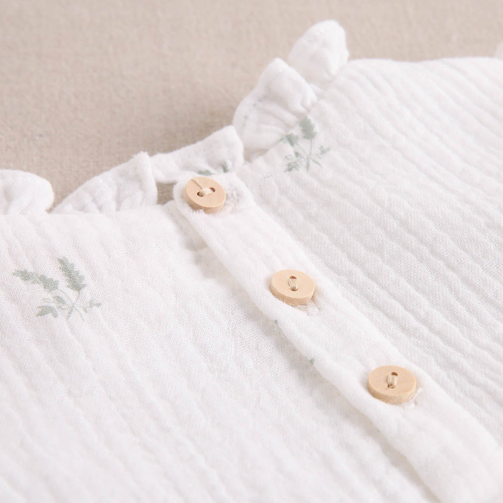 Ranita bebé niña crudo con estampado de ramas verde pastel