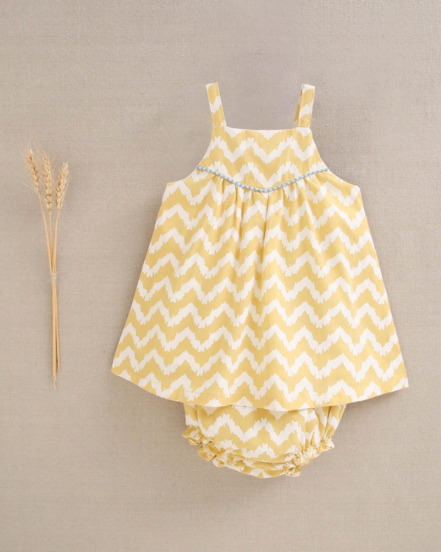 Vestido bebé niña zigzag mostaza y blanco  con turquesa