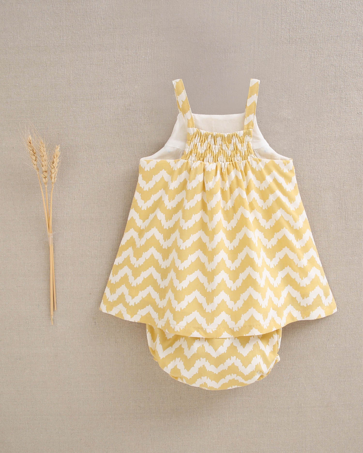 Vestido bebé niña zigzag mostaza y blanco  con turquesa
