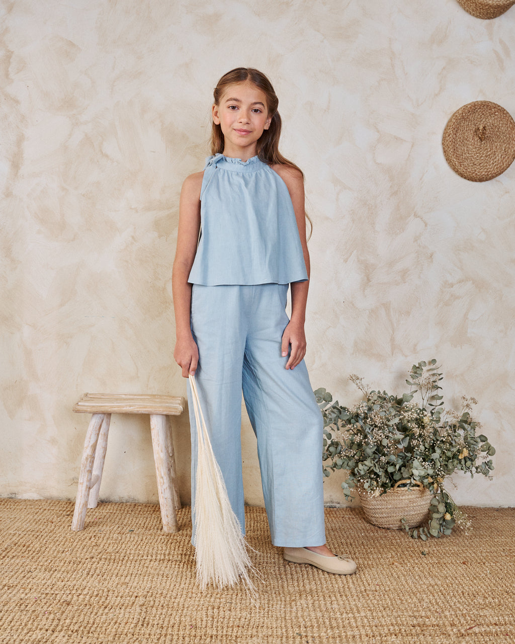 Enterito niña azul con cuello halter y nudo