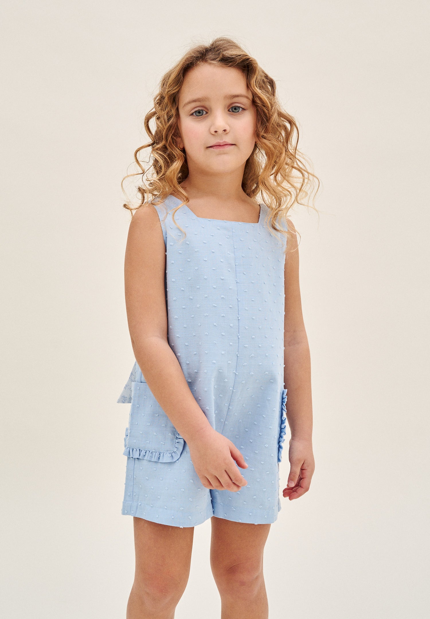 Enterito niña corto de plumeti azul con maxi lazo