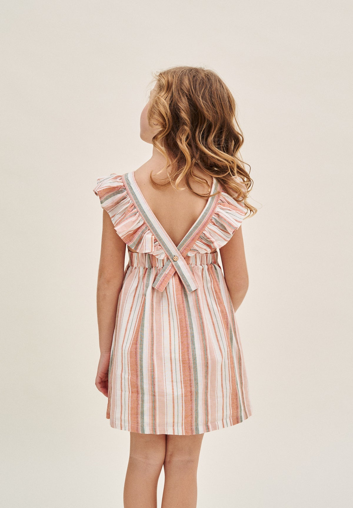 Vestido niña de mix de rayas naranjas, verdes y blancas y espalda cruzada