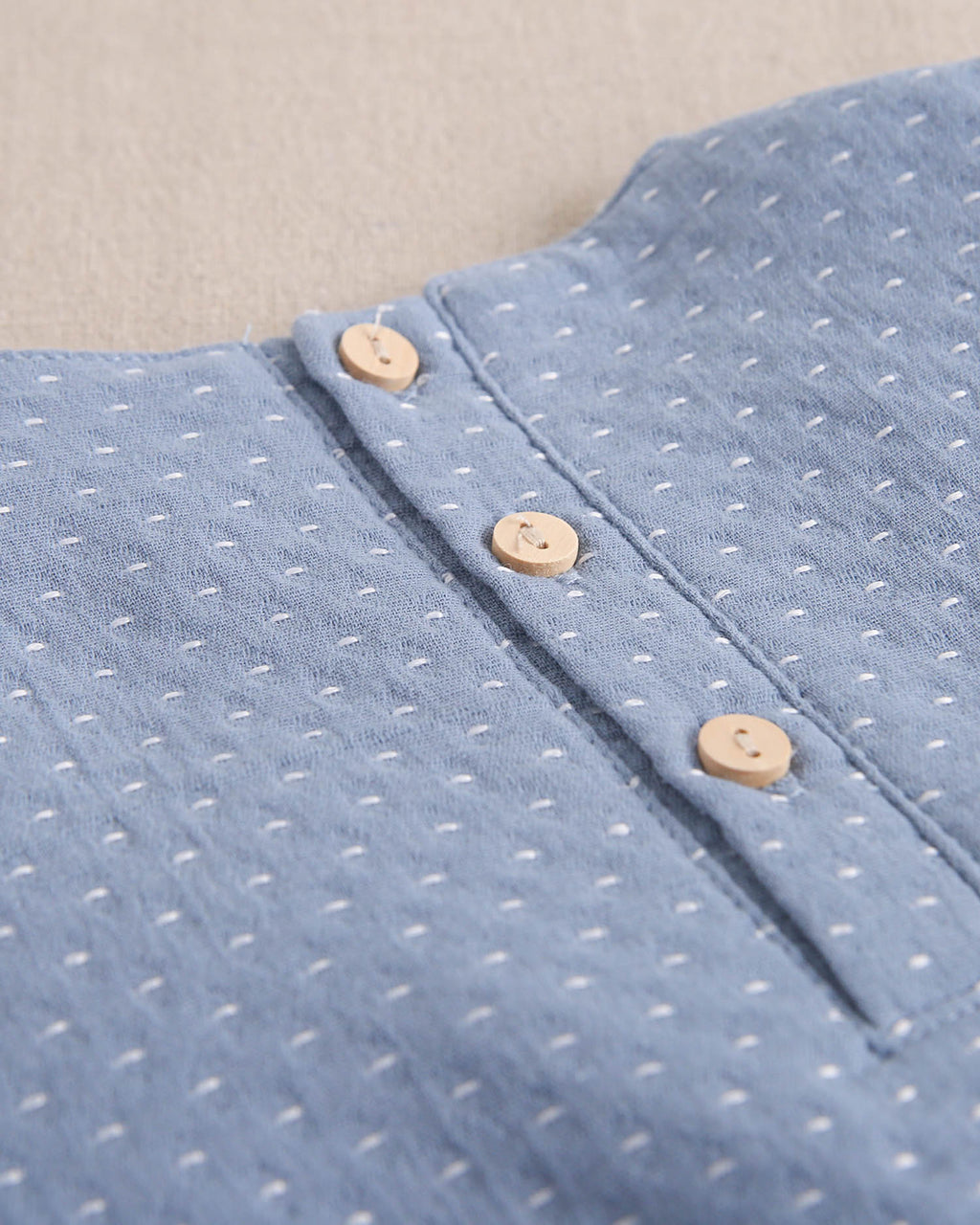 Vestido de bebé niña azul con detalle de lazo y topitos blancos