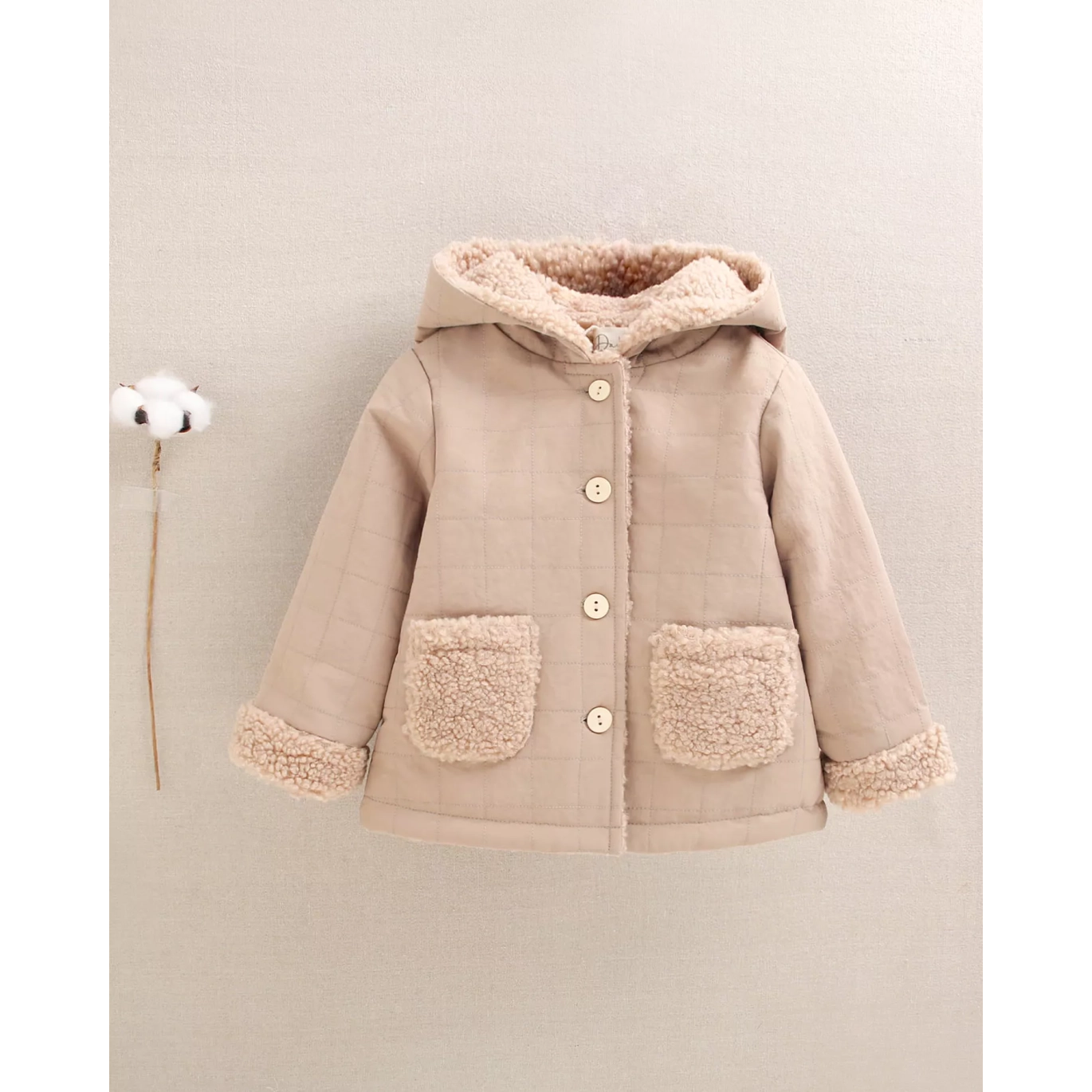 Abrigo reversible de bebé en beige con capucha
