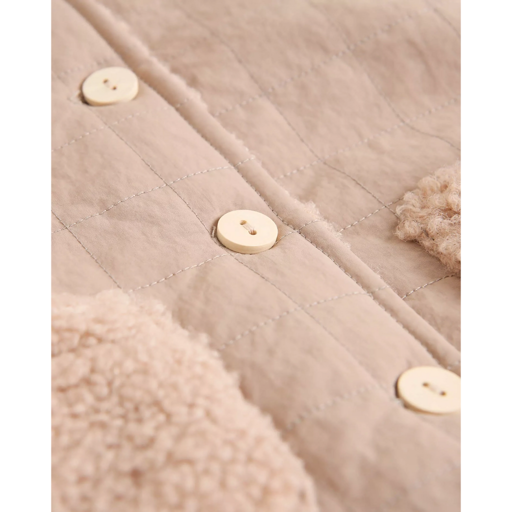 Abrigo reversible de bebé en beige con capucha