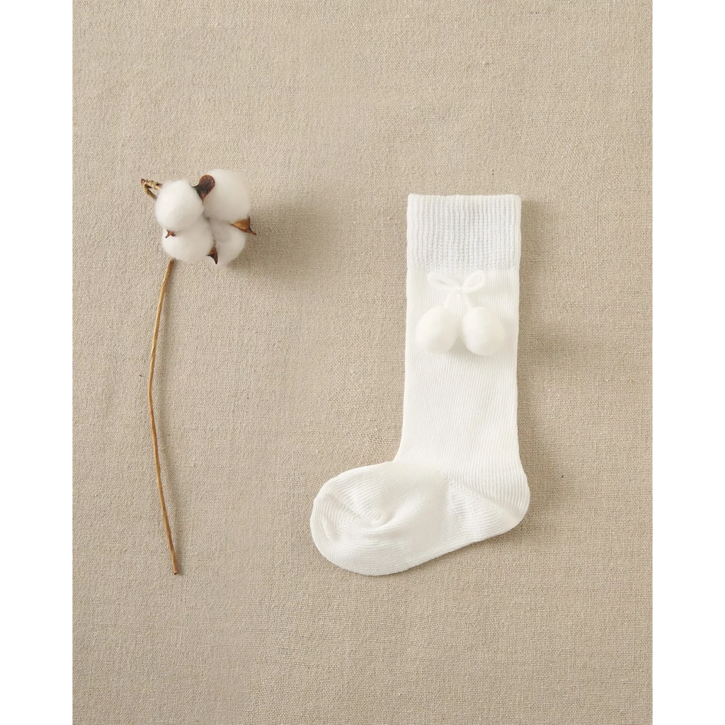 Calcetín bebé blanco con borla