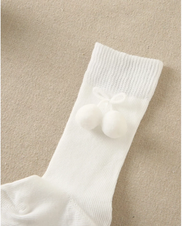 Calcetín bebé blanco con borla