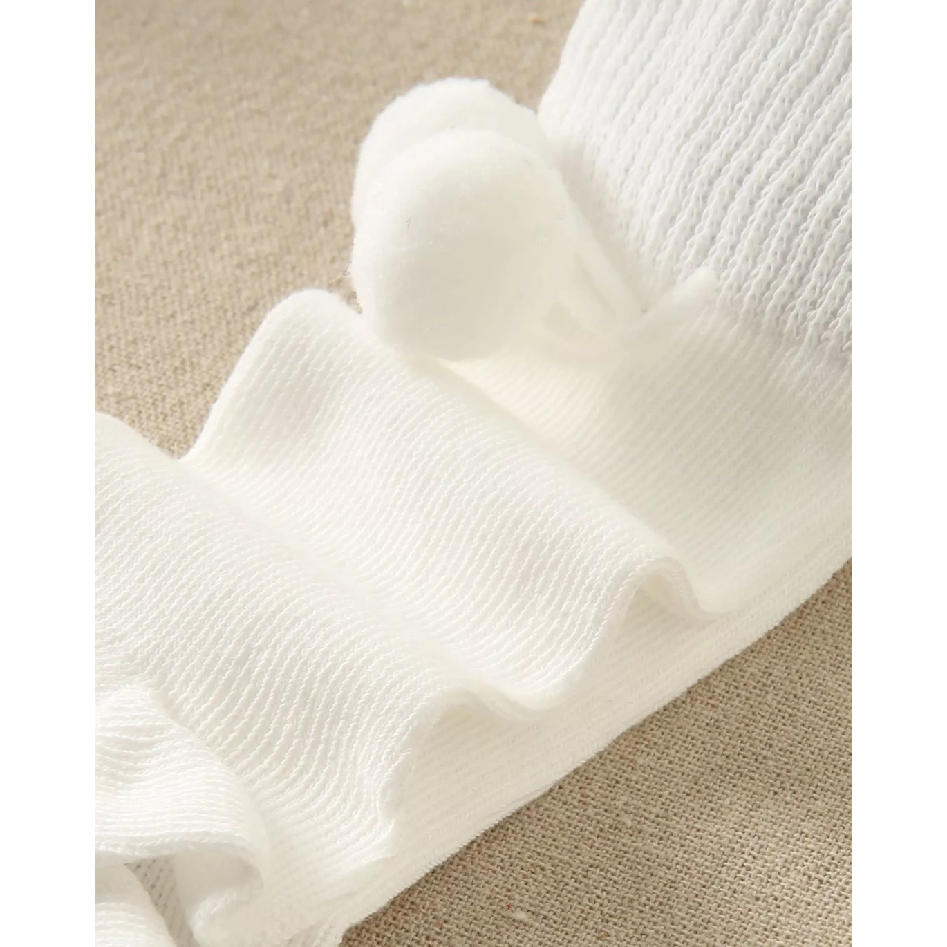 Calcetín bebé blanco con borla