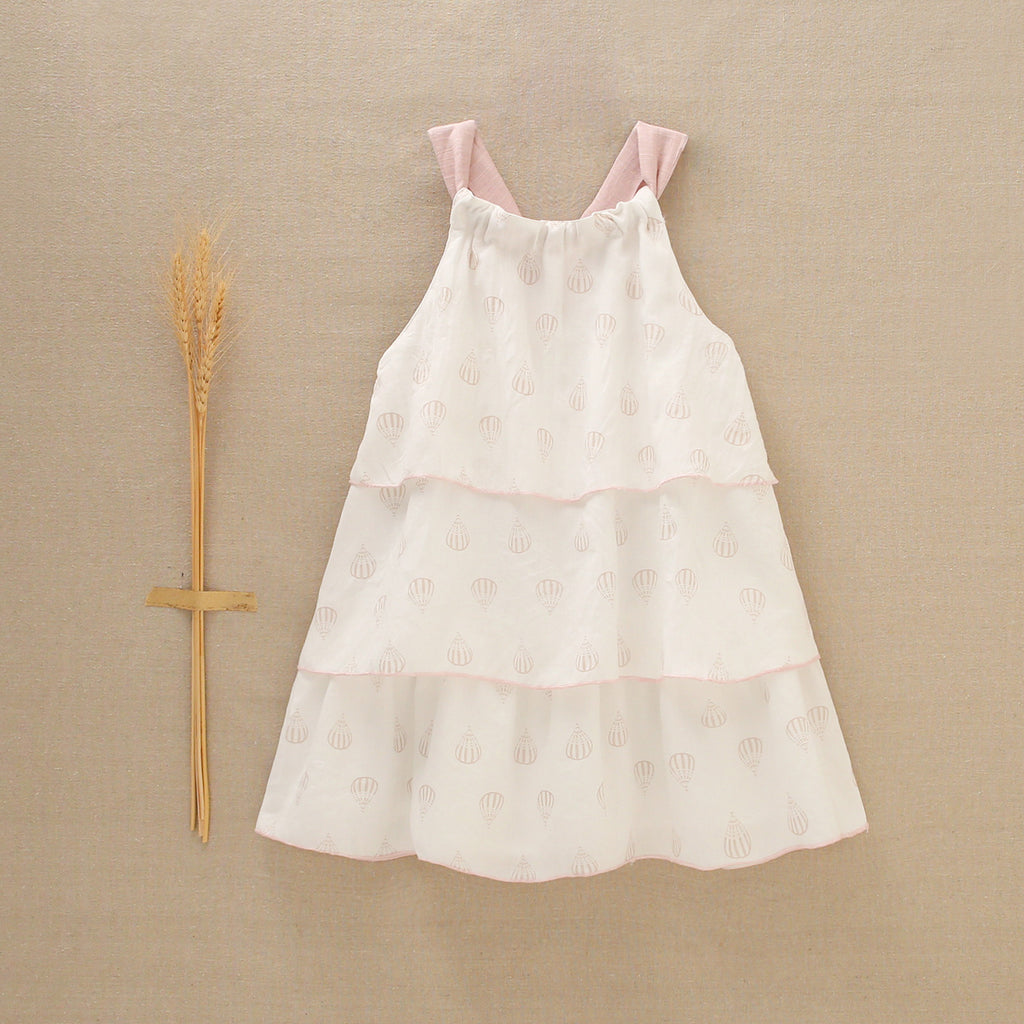 Vestido de niña blanco con globos y detalles en rosa