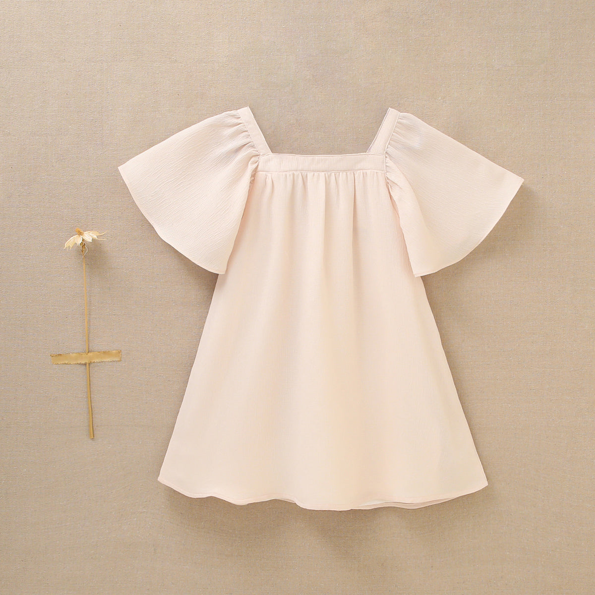 Vestido de niña en gasa en color beige